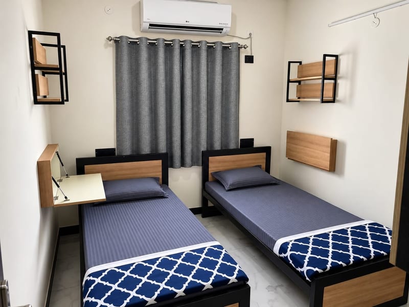 Double Sharing — Deluxe room at Lively Nest